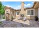 Charming back patio with an outdoor fireplace, stone flooring, and inviting seating area for gatherings at 9375 Gold Lake Ave, Las Vegas, NV 89149