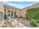 Serene outdoor seating area with stone-paved patio, lush greenery, and space for tranquil relaxation at 9375 Gold Lake Ave, Las Vegas, NV 89149