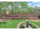Well-maintained backyard with decorative brickwork and mature landscaping elements at 9375 Gold Lake Ave, Las Vegas, NV 89149