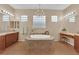 Bathroom featuring an oversized tub and vanity with lighting at 9375 Gold Lake Ave, Las Vegas, NV 89149
