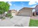 Charming single-story home featuring a three-car garage and meticulously landscaped front yard at 9375 Gold Lake Ave, Las Vegas, NV 89149