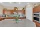 Kitchen with granite counters, stainless appliances, and wood cabinets with built-in ovens at 9375 Gold Lake Ave, Las Vegas, NV 89149