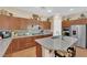 Kitchen with granite countertops, stainless steel appliances, and wood cabinets at 9375 Gold Lake Ave, Las Vegas, NV 89149