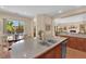 Kitchen with granite countertops, stainless appliances, and backyard views at 9375 Gold Lake Ave, Las Vegas, NV 89149