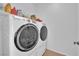 Modern laundry room featuring front load washer and dryer for added convenience at 9375 Gold Lake Ave, Las Vegas, NV 89149