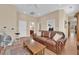 Bright living room with leather sofa, exercise equipment and a cozy rug at 9375 Gold Lake Ave, Las Vegas, NV 89149