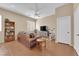 Comfortable living room showcasing neutral walls, leather sofa and a ceiling fan for added comfort at 9375 Gold Lake Ave, Las Vegas, NV 89149