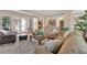 Spacious living room boasting comfortable seating, abundant natural light, and a seamless flow to the outdoors at 9375 Gold Lake Ave, Las Vegas, NV 89149