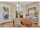 Office featuring natural light, an ornate desk, and access to the backyard patio at 9375 Gold Lake Ave, Las Vegas, NV 89149