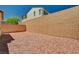 Backyard featuring gravel and a tall block wall for privacy at 10024 Rams Leap Ave, Las Vegas, NV 89166