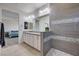 Beautiful bathroom with double sinks, granite countertops, and an elegant walk-in shower at 10024 Rams Leap Ave, Las Vegas, NV 89166