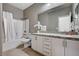 Bathroom with vanity, granite counters, and shower-tub combination at 10024 Rams Leap Ave, Las Vegas, NV 89166