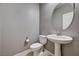 Bathroom featuring a pedestal sink, oval mirror, and neutral paint at 10024 Rams Leap Ave, Las Vegas, NV 89166