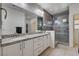 Luxurious bathroom with granite countertops, a walk-in shower, and stylish decor at 10024 Rams Leap Ave, Las Vegas, NV 89166
