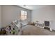 Bright bedroom features neutral carpet, window, and space for play area at 10024 Rams Leap Ave, Las Vegas, NV 89166
