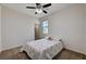 Well-lit bedroom featuring neutral walls, and ceiling fan at 10024 Rams Leap Ave, Las Vegas, NV 89166
