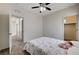 Bedroom with view into closet and neutral walls, and ceiling fan at 10024 Rams Leap Ave, Las Vegas, NV 89166