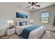 Comfortable bedroom features a plush bed, stylish decor, and ample natural light at 10024 Rams Leap Ave, Las Vegas, NV 89166