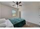 Bright bedroom with a ceiling fan and window providing natural light at 10024 Rams Leap Ave, Las Vegas, NV 89166