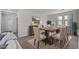 Elegant dining room featuring a large table, seating for eight, and stylish decor at 10024 Rams Leap Ave, Las Vegas, NV 89166