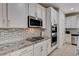 Updated kitchen featuring stainless steel appliances, gas cooktop, and tiled backsplash at 10024 Rams Leap Ave, Las Vegas, NV 89166