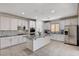 Contemporary kitchen is equipped with stainless steel appliances, granite countertops and tile flooring at 10024 Rams Leap Ave, Las Vegas, NV 89166