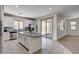 Large eat-in kitchen featuring granite counters, stainless appliances, and access to an outdoor patio at 10024 Rams Leap Ave, Las Vegas, NV 89166