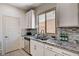 Stylish kitchen includes granite counters, stainless appliances, and ample cabinet space at 10024 Rams Leap Ave, Las Vegas, NV 89166