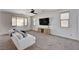 Spacious living room with comfortable seating, media console, and neutral decor at 10024 Rams Leap Ave, Las Vegas, NV 89166