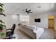 Upstairs living room featuring ceiling fan, modern TV, and comfortable seating at 10024 Rams Leap Ave, Las Vegas, NV 89166