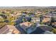 An aerial view showcases the well-maintained residential neighborhood with desert landscaping and mountain views at 10058 Saint Augustine St, Las Vegas, NV 89183