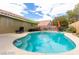 Inviting backyard pool with plenty of lounge area, a desert landscaped perimeter, and a shaded pergola at 10058 Saint Augustine St, Las Vegas, NV 89183