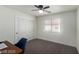 Office space with a built-in closet, a window and a desk with modern computer at 10058 Saint Augustine St, Las Vegas, NV 89183