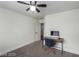 Bedroom featuring a desk and computer, neutral walls and carpet flooring, with a ceiling fan at 10058 Saint Augustine St, Las Vegas, NV 89183