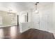 Bright entryway features new, dark hardwood floors and modern lighting at 10058 Saint Augustine St, Las Vegas, NV 89183