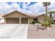 Inviting one-story home with a two-car garage and desert-style landscaping at 10058 Saint Augustine St, Las Vegas, NV 89183