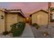 Inviting single-story home with manicured landscaping and an arched front window at 10058 Saint Augustine St, Las Vegas, NV 89183