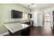 Stylish kitchen with granite countertops, stainless steel appliances, and ample counter space for cooking and entertaining at 10058 Saint Augustine St, Las Vegas, NV 89183
