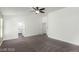 Spacious main bedroom featuring carpet, great natural light, and access to the en-suite bathroom and closets at 10058 Saint Augustine St, Las Vegas, NV 89183