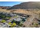 Expansive aerial shot capturing a modern home nestled near mountains at 10228 Shell Star Ave, Las Vegas, NV 89135