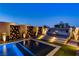 Beautiful backyard featuring a pool, unique privacy screens and a comfortable upper-deck seating area with a fire pit at 10228 Shell Star Ave, Las Vegas, NV 89135