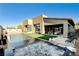 Stunning backyard with a large pool, hot tub, manicured lawn, and stylish outdoor seating area at 10228 Shell Star Ave, Las Vegas, NV 89135