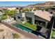 Aerial view of a backyard with a pool, spa, and an outdoor firepit area at 10228 Shell Star Ave, Las Vegas, NV 89135