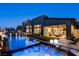 Lavish backyard with pool, hot tub, lounge area, and outdoor kitchen, perfect for upscale entertaining at 10228 Shell Star Ave, Las Vegas, NV 89135