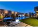 Beautiful backyard featuring a pool, spa, unique water feature, and a comfortable seating area at 10228 Shell Star Ave, Las Vegas, NV 89135
