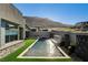 Backyard with a sparkling pool, spa and elegant water feature at 10228 Shell Star Ave, Las Vegas, NV 89135