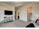 Bedroom with walk-in closet, ensuite bathroom, and large-screen TV at 10228 Shell Star Ave, Las Vegas, NV 89135