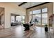 Bright dining area with wood floors, high ceilings, modern lighting and access to the outdoor patio at 10228 Shell Star Ave, Las Vegas, NV 89135
