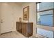 Entryway with a cabinet, a bulletin board, and natural light from the window at 10228 Shell Star Ave, Las Vegas, NV 89135