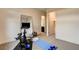Home gym with exercise equipment, a mirror, and a view into an ensuite bathroom at 10228 Shell Star Ave, Las Vegas, NV 89135